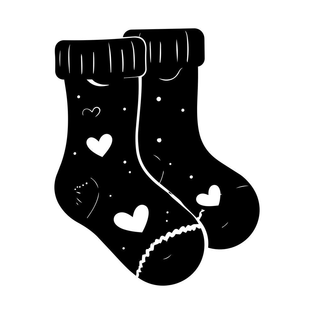 Pair of baby socks with folded cuffs decorated with cutout hearts and dots