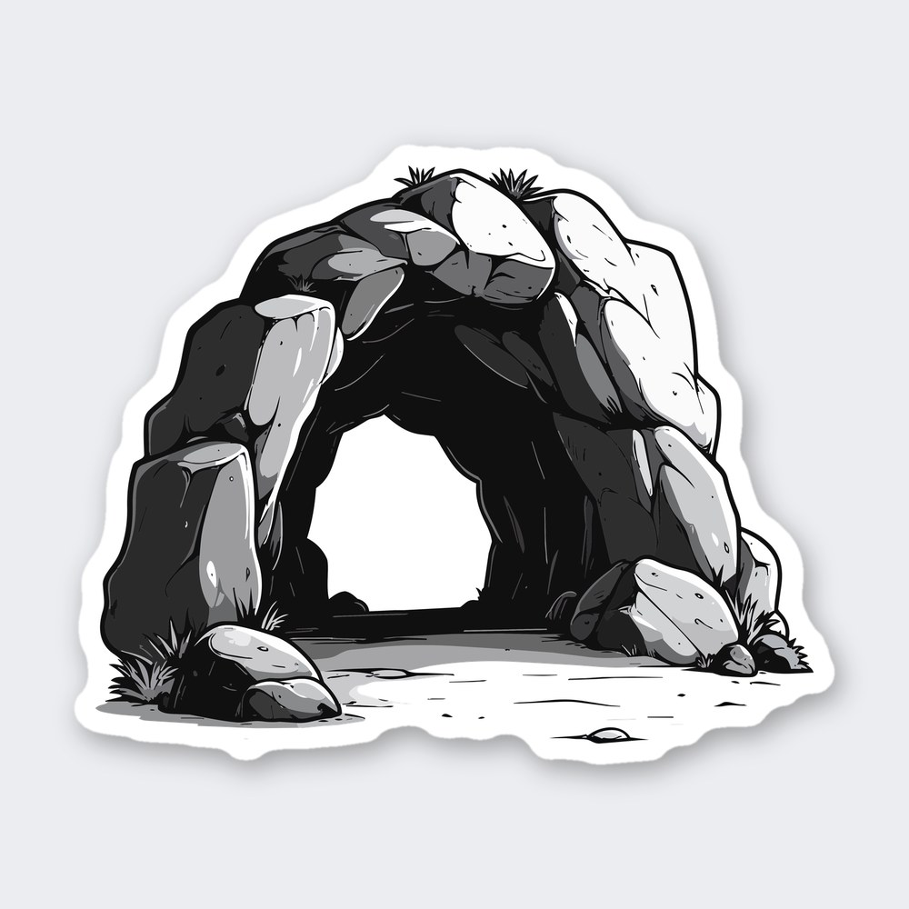 Grayscale sticker of a rocky cave entrance with stacked boulders, grass tufts and dark opening