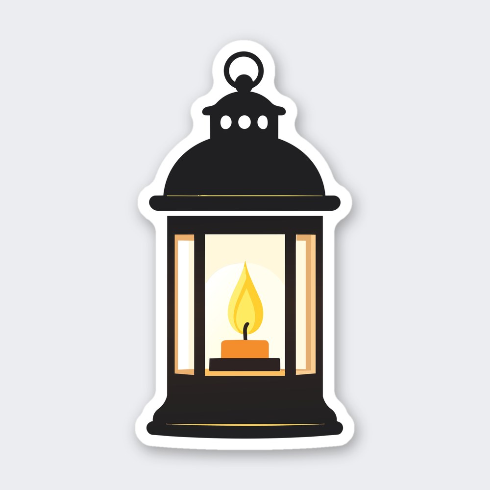 Black lantern with ring handle, amber glass panels and a lit orange candle with yellow flame