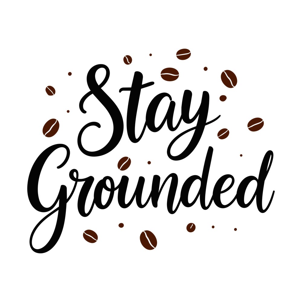 Black script reading Stay Grounded surrounded by scattered brown coffee beans and small dots