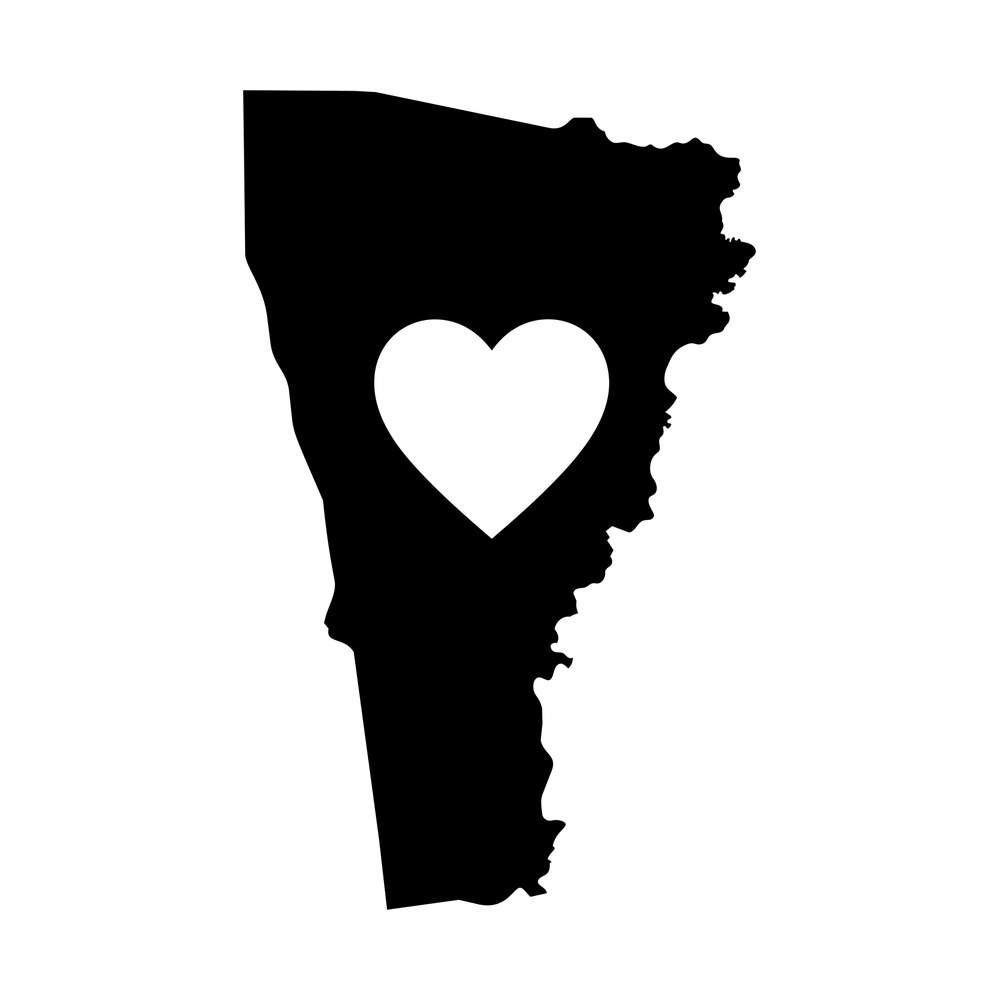 Black Vermont state map sticker with a white heart cut out of the center